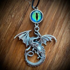 Dragon eye silver tone necklace pendant - cast dragon with blue and green eye